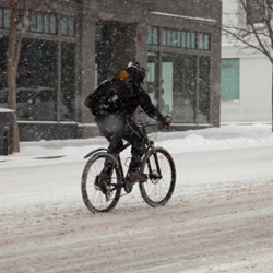 How do the changing seasons affect urban bike riders?